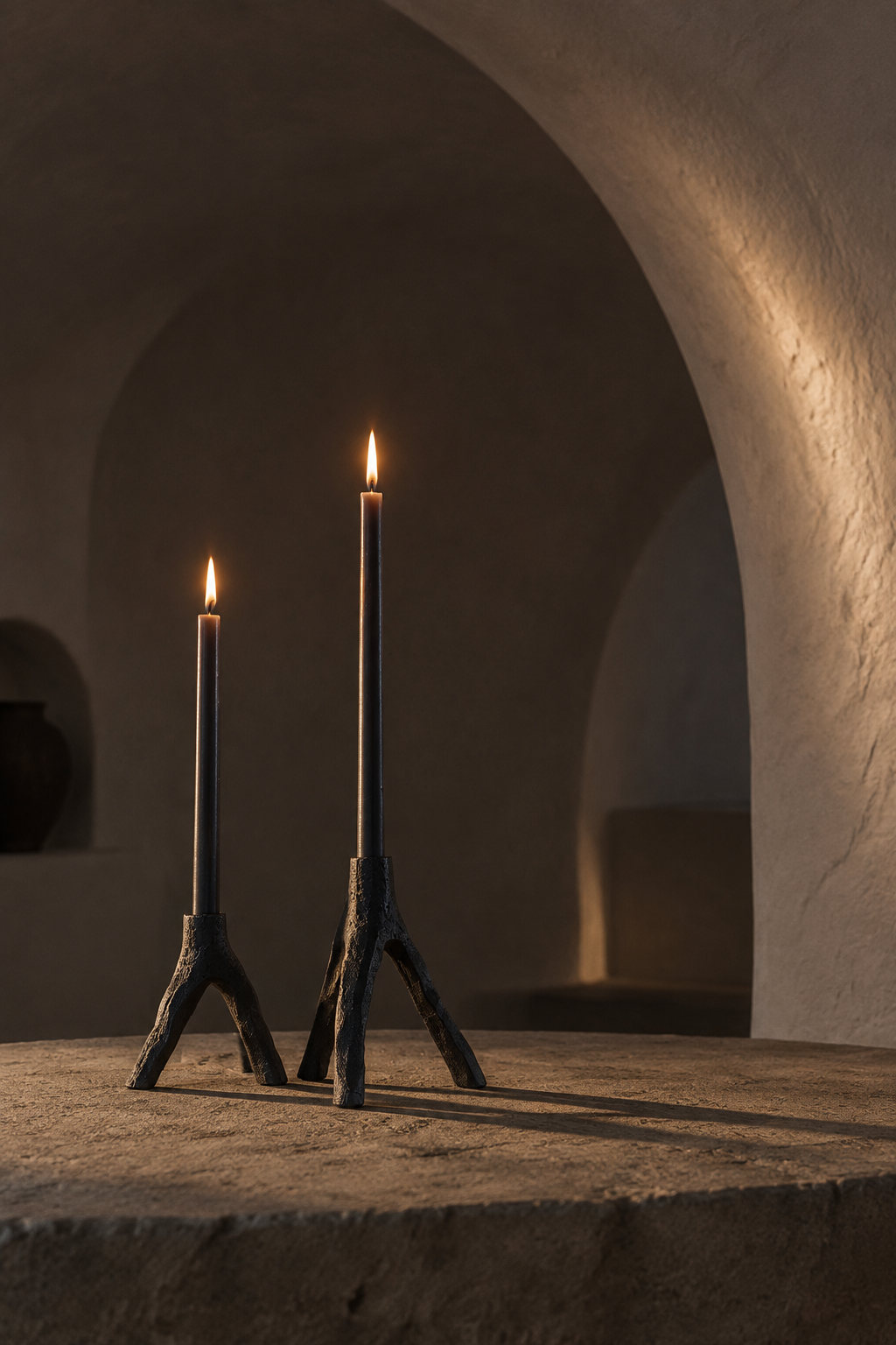 Candles lit in a vaulted interior
