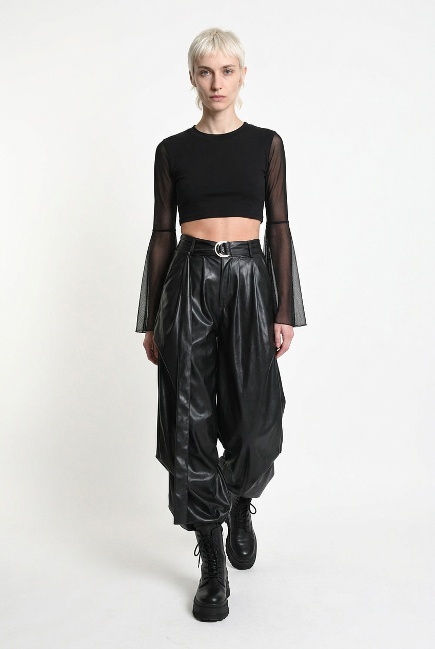 LA HAINE INSIDE US W5468 faux leather trousers in black — walking editorial view