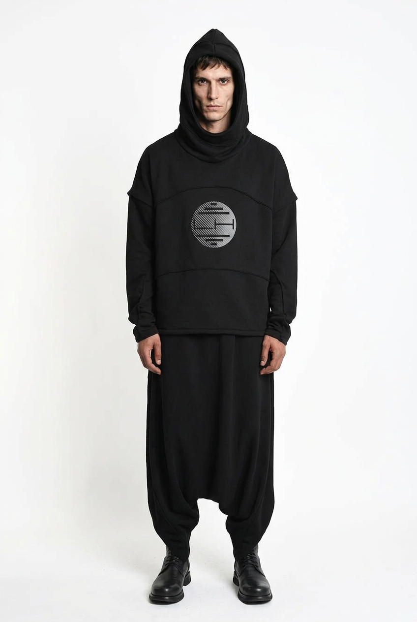 LA HAINE INSIDE US M1334 hoodie in black — front view on male model with long sleeves attached