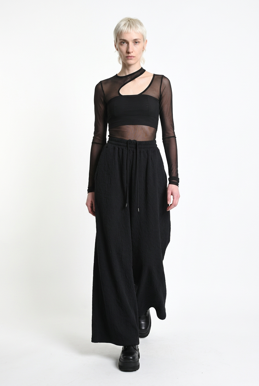LA HAINE INSIDE US W5451 black embossed fleece palazzo trousers, walking front view