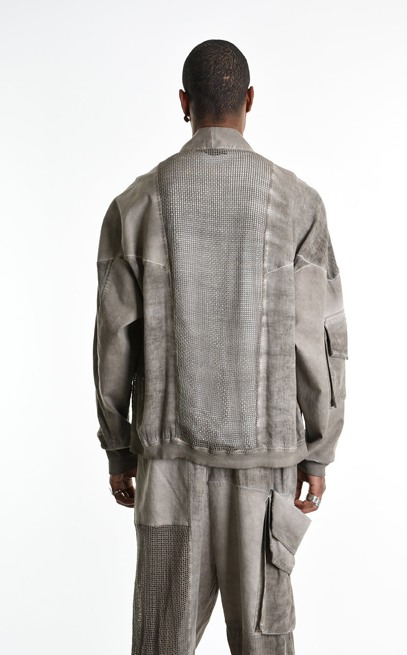 Person wearing a gray textured outfit with 'La Haine Inside Us' text on a white background