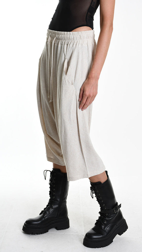 Unisex A33M M101125 short pants in ecru viscose linen blend with elastic waist and pockets.