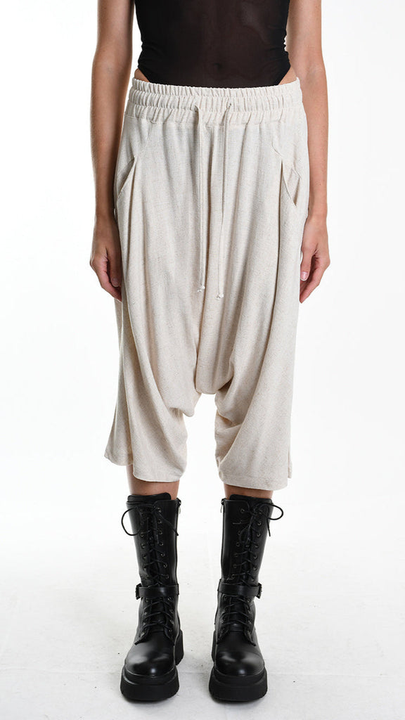 Unisex A33M M101125 PANT/SHORT in beige, featuring low crotch, elastic waist, and pockets, made from viscose linen blend.