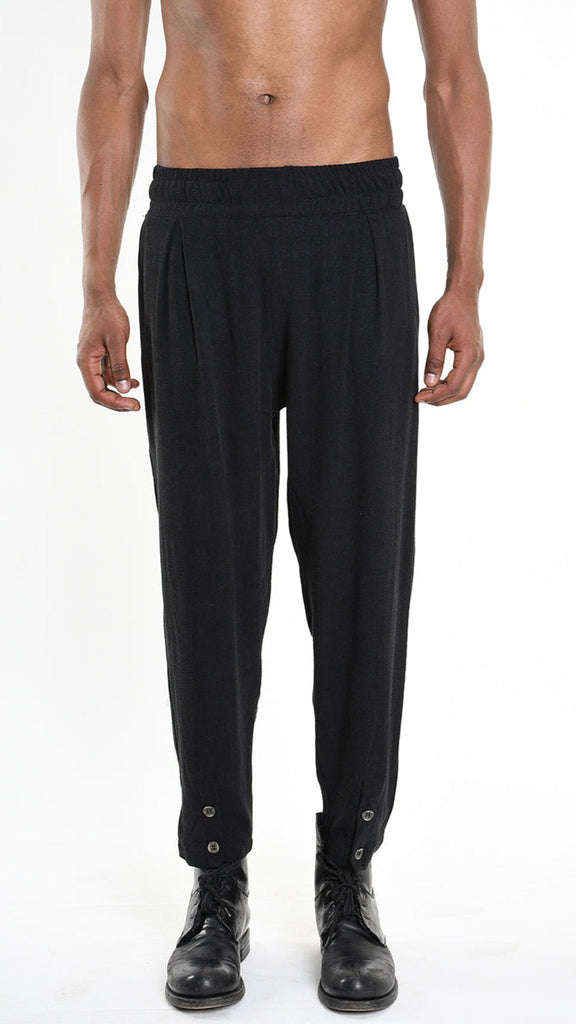 A33M M101225 TROUSER in black with button detail, regular fit, elastic waist, and pockets.