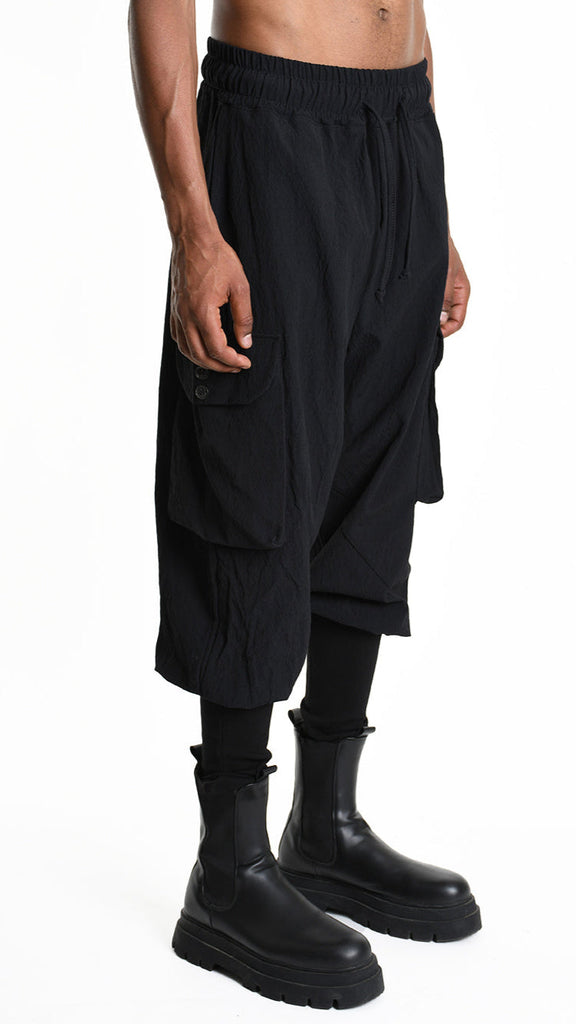 Baggy cotton jacquard unisex trousers with elastic waist and ribbed bottom.