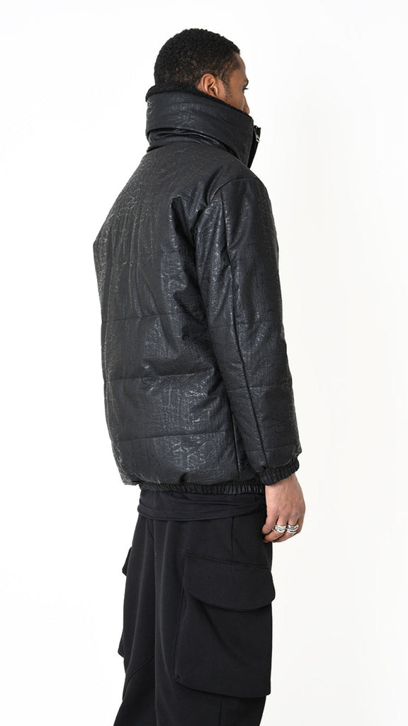 Jacket in faux leather graphite with faux fur lining, featuring padded design and zip closure.