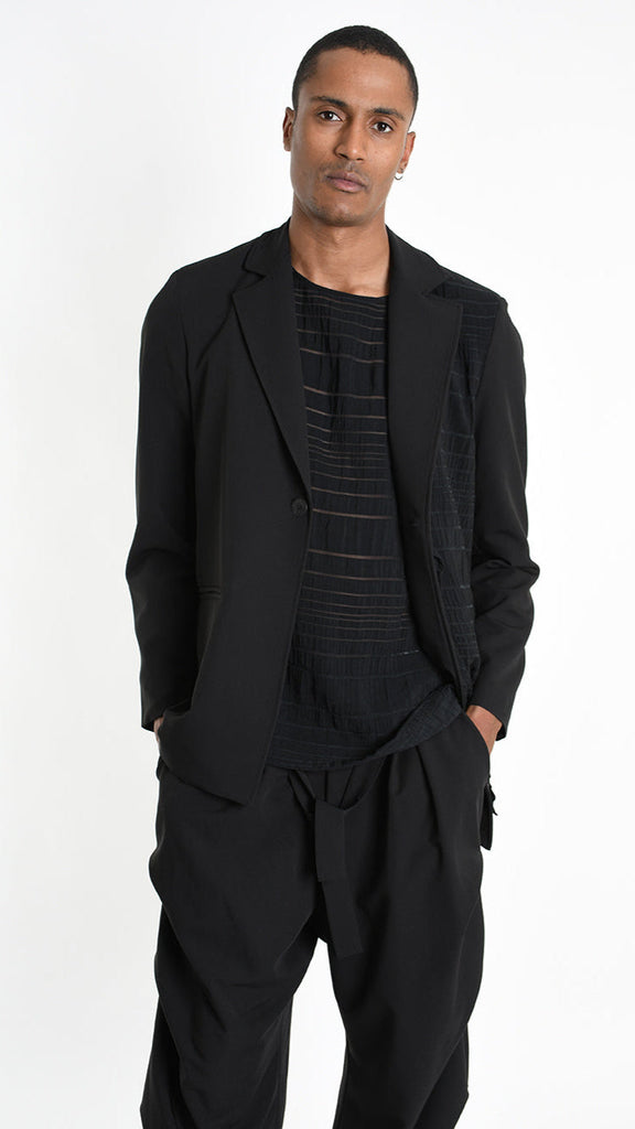 A33R M102825 JACKET in black with fluid fabric and devoré viscose panel, worn by a model.