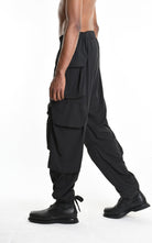 Person wearing black cargo pants on a white background with 'La Haine Inside Us' text.