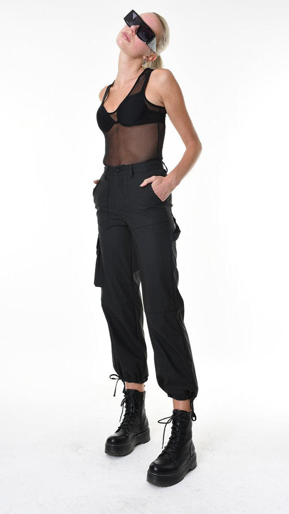 A34Z LW68825 TROUSER in black rubberized technical fabric with stretch, worn by model.