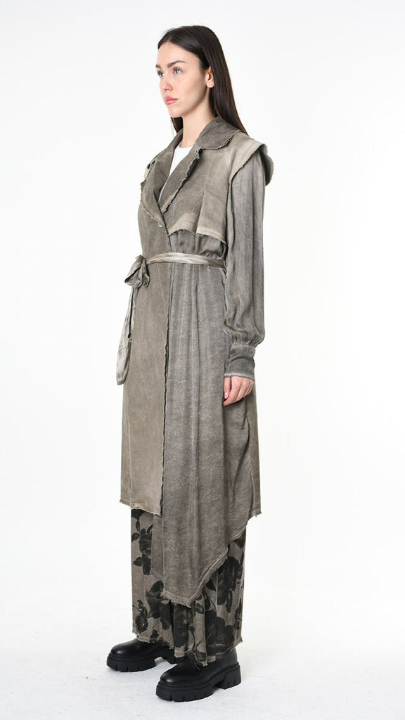 A39B SM45125 Trench coat in grey with asymmetrical design and raw cut detailing.