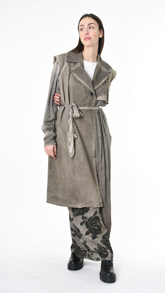 A39B SM45125 Trench in waxed cotton gabardine with viscose satin inserts, asymmetrical design.