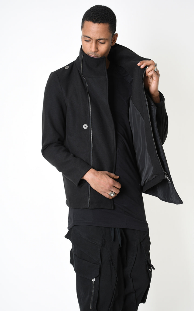 A33B LM18525 COAT in black with asymmetrical design and nylon insert.