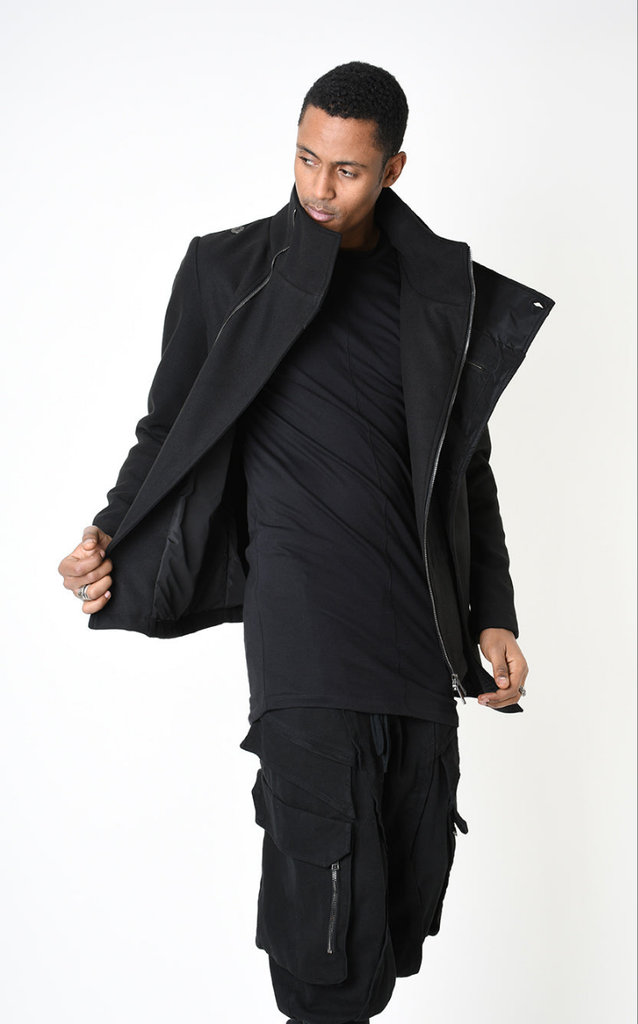 A33B LM18525 COAT in black with asymmetrical design, nylon insert, and functional pockets.