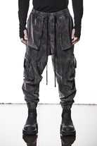 M P 21 – Used Grey Men’s cargo trousers in washed grey with zip/flap pockets, drawstring waist, and elastic cuffs THOM KROM