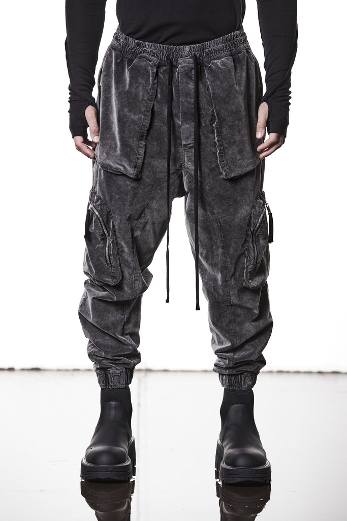 M P 21 – Used Grey Men’s cargo trousers in washed grey with zip/flap pockets, drawstring waist, and elastic cuffs THOM KROM