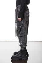 M P 21 – Used Grey Men’s cargo trousers in washed grey with zip/flap pockets, drawstring waist, and elastic cuffs THOM KROM