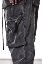 M P 21 – Used Grey Men’s cargo trousers in washed grey with zip/flap pockets, drawstring waist, and elastic cuffs THOM KROM