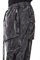 M P 21 – Used Grey Men’s cargo trousers in washed grey with zip/flap pockets, drawstring waist, and elastic cuffs THOM KROM
