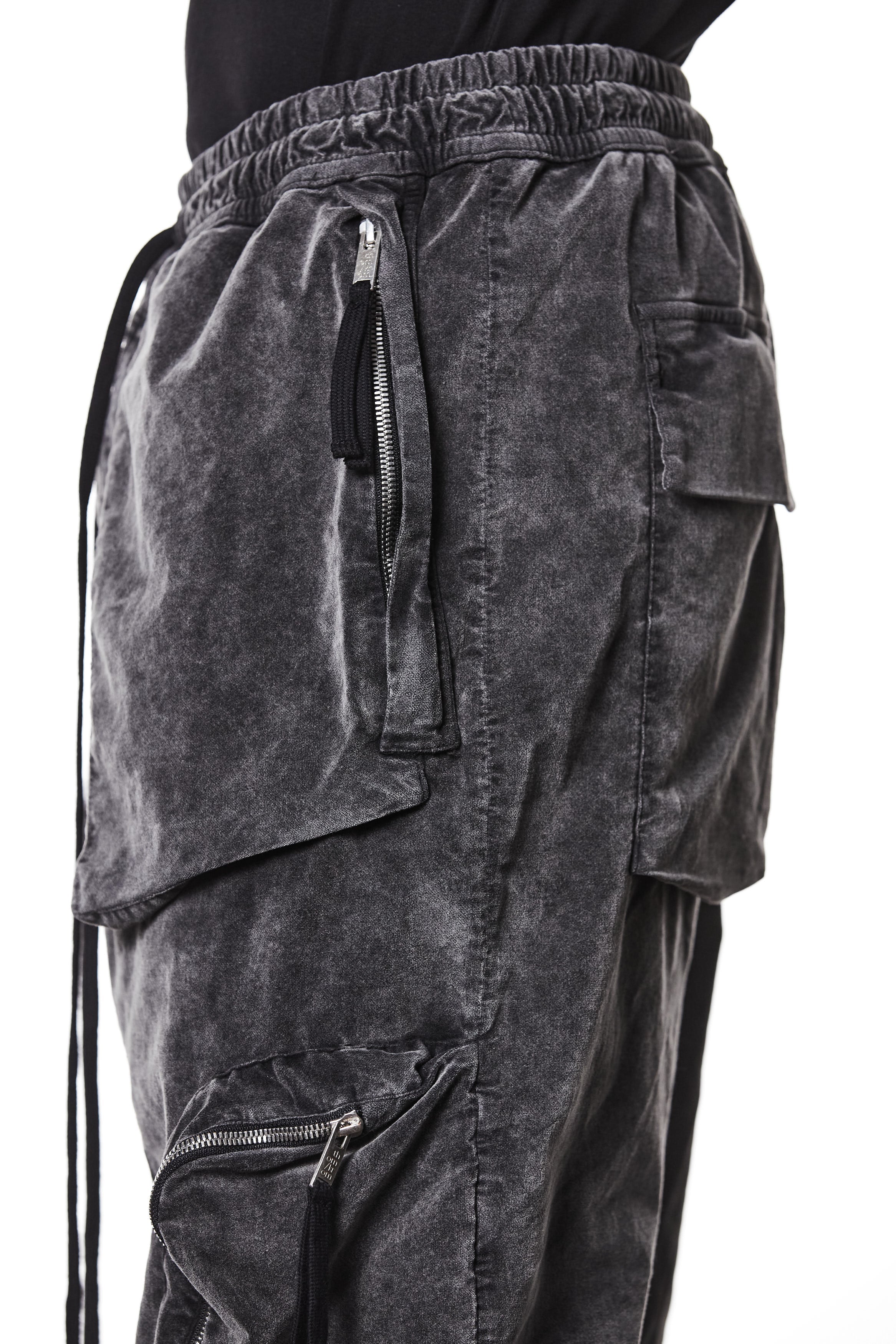 M P 21 – Used Grey Men’s cargo trousers in washed grey with zip/flap pockets, drawstring waist, and elastic cuffs THOM KROM