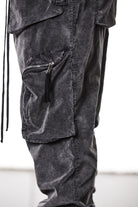 M P 21 – Used Grey Men’s cargo trousers in washed grey with zip/flap pockets, drawstring waist, and elastic cuffs THOM KROM