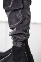 M P 21 – Used Grey Men’s cargo trousers in washed grey with zip/flap pockets, drawstring waist, and elastic cuffs THOM KROM