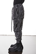 M P 21 – Used Grey Men’s cargo trousers in washed grey with zip/flap pockets, drawstring waist, and elastic cuffs THOM KROM