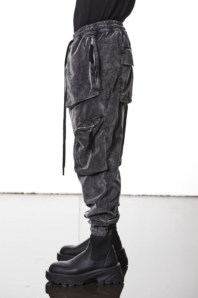 M P 21 – Used Grey Men’s cargo trousers in washed grey with zip/flap pockets, drawstring waist, and elastic cuffs THOM KROM