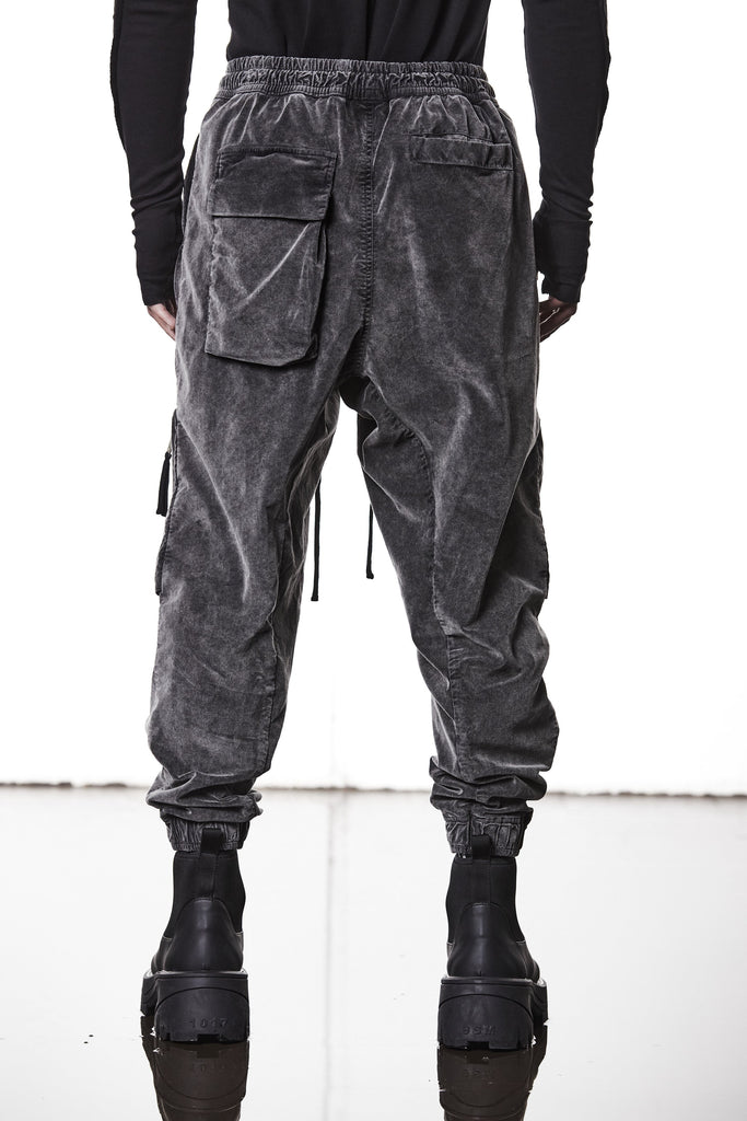 M P 21 – Used Grey Men’s cargo trousers in washed grey with zip/flap pockets, drawstring waist, and elastic cuffs THOM KROM