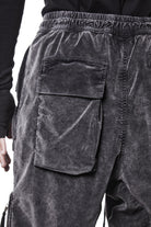 M P 21 – Used Grey Men’s cargo trousers in washed grey with zip/flap pockets, drawstring waist, and elastic cuffs THOM KROM