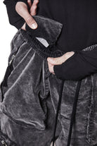 M P 21 – Used Grey Men’s cargo trousers in washed grey with zip/flap pockets, drawstring waist, and elastic cuffs THOM KROM