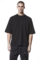 M TS 882_black – Oversized short-sleeve T-shirt in black with dropped shoulders, straight hem, and signature back stitch - Man THOM KROM