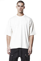 M TS 882 Cream – Oversized short-sleeve T-shirt in black with dropped shoulders, straight hem, and signature back stitch - Man THOM KROM