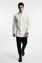 LA HAINE INSIDE US LM226 white long cotton stretch shirt — full length walking toward camera