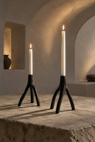 Candles lit in a vaulted interior