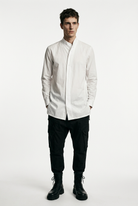 LA HAINE INSIDE US LM226 white long cotton stretch shirt — hands in pockets