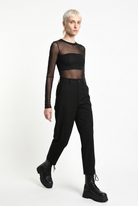 LA HAINE INSIDE US black carrot-fit trousers, three-quarter walking view