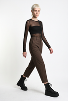 LA HAINE INSIDE US brown carrot-fit trousers, walking side-front view