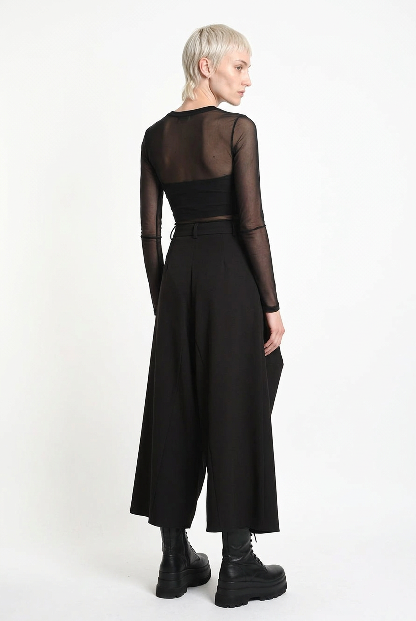 LA HAINE INSIDE US W5517 oversized techno stretch trousers in black — rear three-quarter editorial view