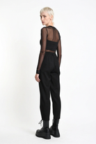 LA HAINE INSIDE US black carrot-fit trousers, rear three-quarter view