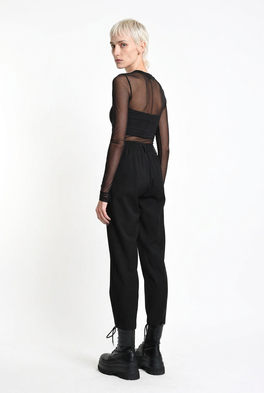 LA HAINE INSIDE US black carrot-fit trousers, rear three-quarter view