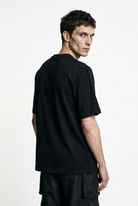 LA HAINE INSIDE US M1375 black oversized cotton stretch T-shirt, three-quarter back view