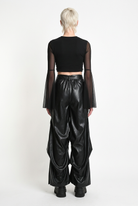 LA HAINE INSIDE US W5468 faux leather trousers in black — back editorial view