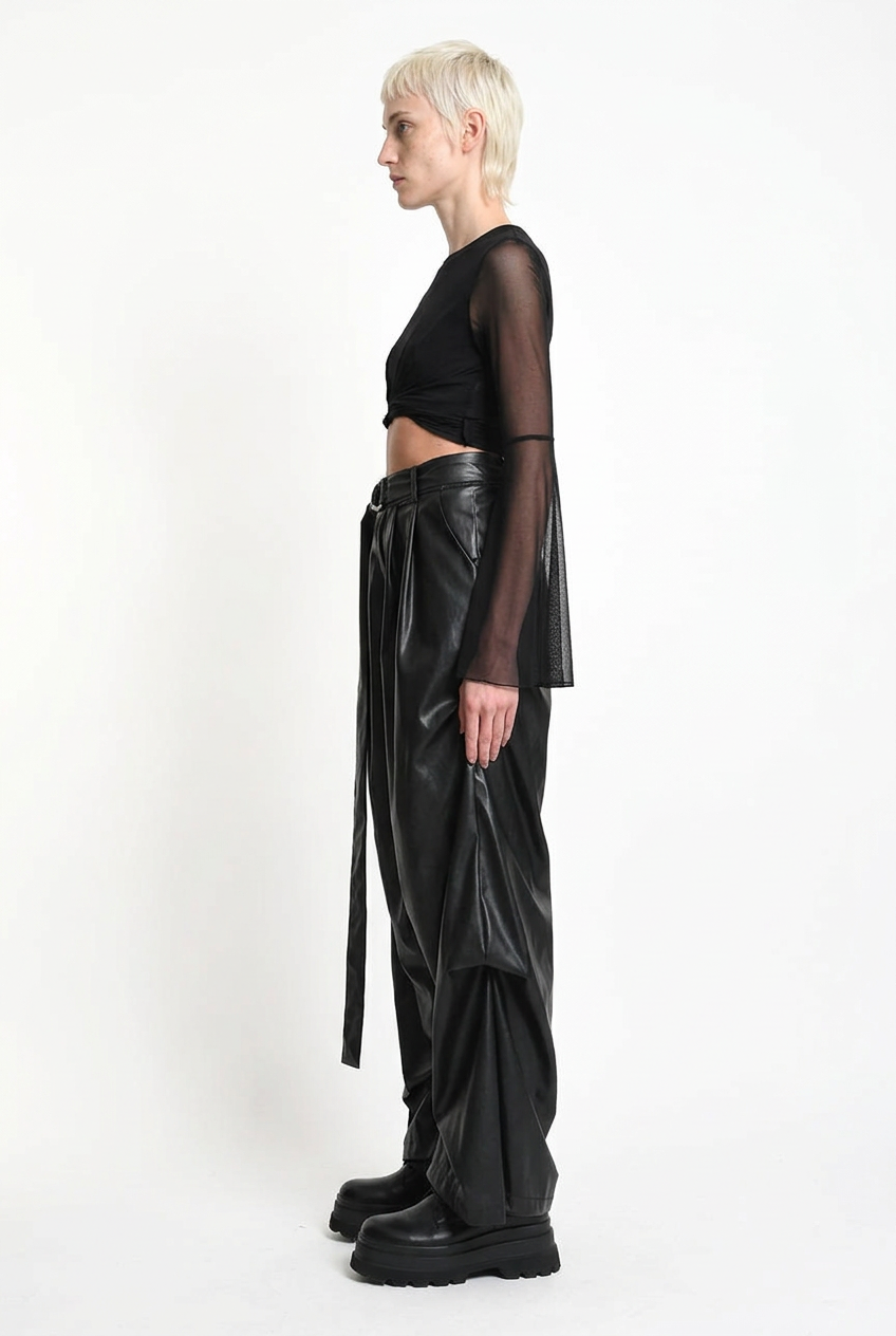 LA HAINE INSIDE US W5468 faux leather trousers in black — side editorial view with hanging sash