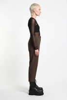 LA HAINE INSIDE US brown carrot-fit trousers, full-length side view