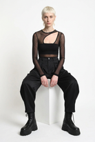 LA HAINE INSIDE US W5469 satin balloon trousers in black — seated editorial view