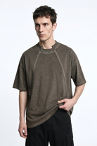 LA HAINE INSIDE US M1295 Mud cold-dyed cotton T-shirt, front view holding hem to show drape