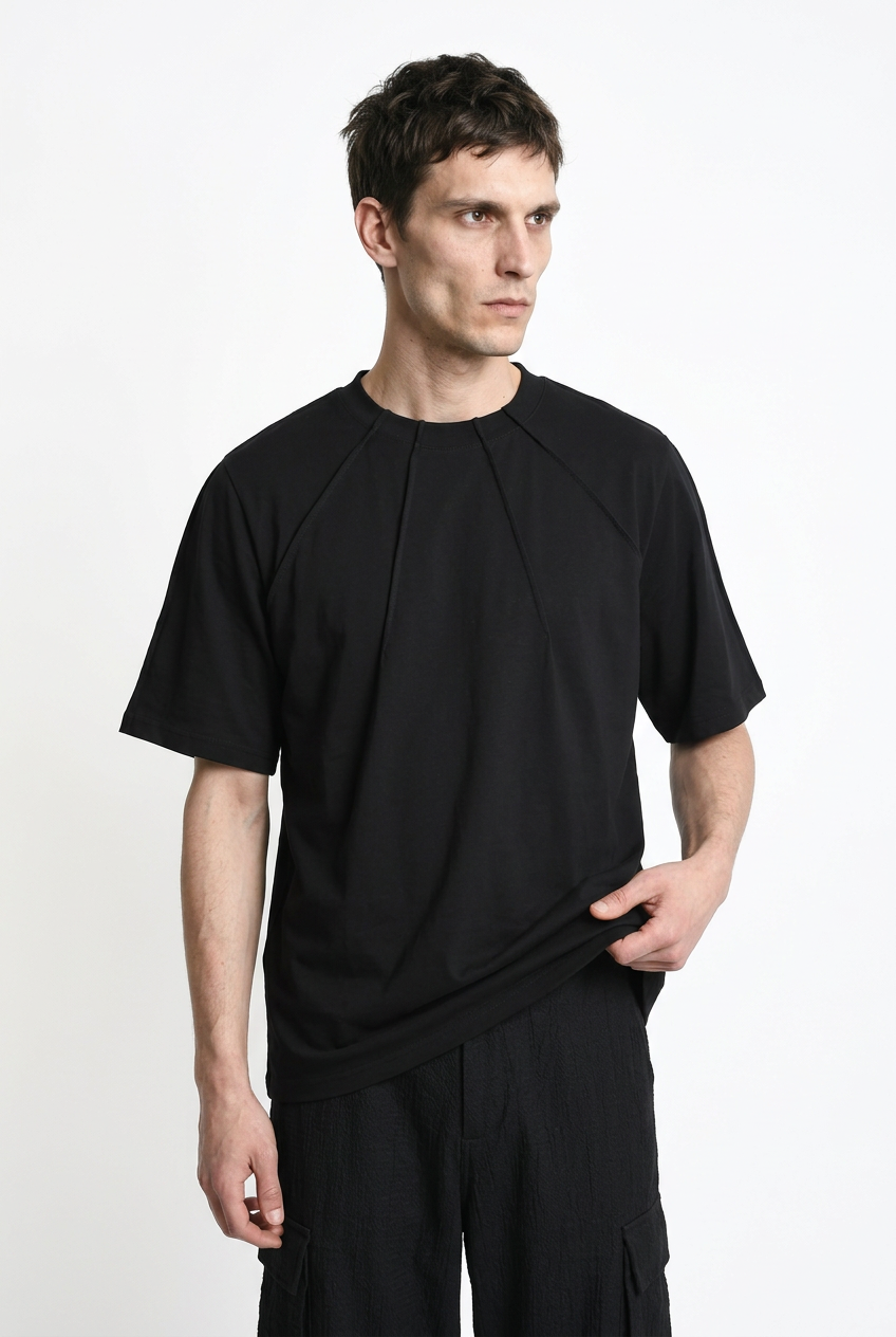 LA HAINE INSIDE US M1375 black oversized cotton stretch T-shirt, front view holding hem to show drape