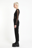 LA HAINE INSIDE US black carrot-fit trousers, full-length side view
