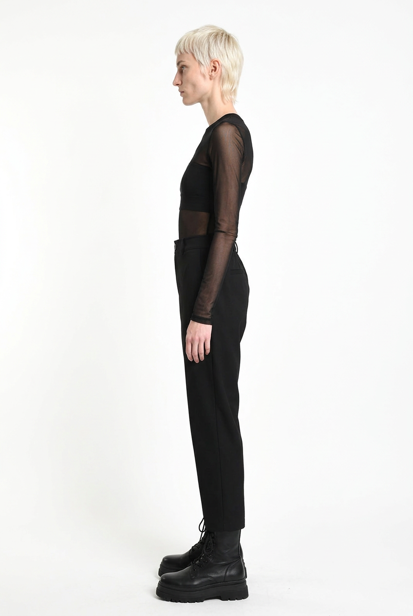 LA HAINE INSIDE US black carrot-fit trousers, full-length side view
