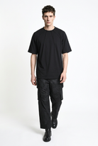 LA HAINE INSIDE US M1375 black oversized cotton stretch T-shirt, full-length walking view